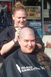 Ann Margaret bravely watching her beautiful hair being cut for Cops for Cancer.