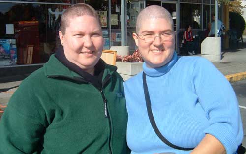 Having faced that together, our two noble sisters pose to show off their new hair styles...or lack thereof hehe